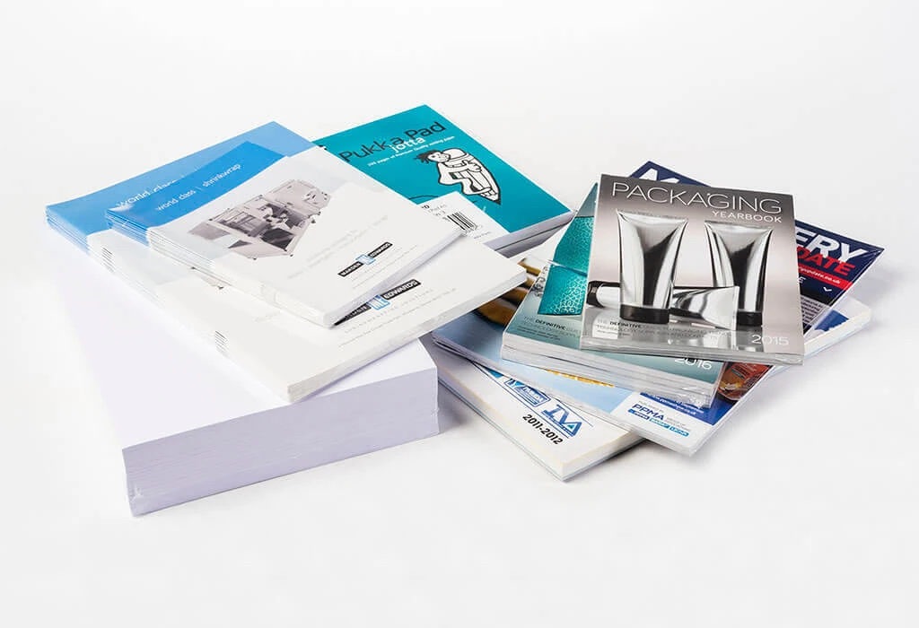 printed matter and paper products shrink wrapped for protection, display and transportation.