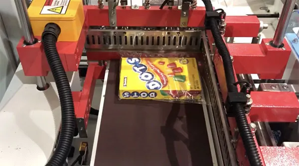 shrink wrapping video of cartons of sweets being wrapped utilising our automatic l sealer