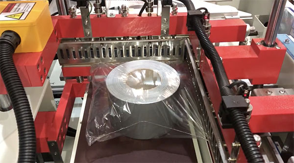 Video of L Sealer shrink wrapping reels of tape