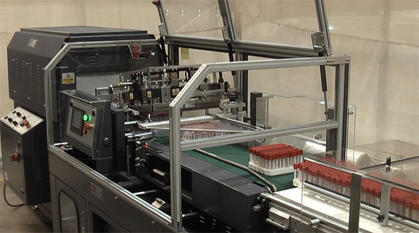 video demonstration of automatic l sealer wrapping pharmaceuticals