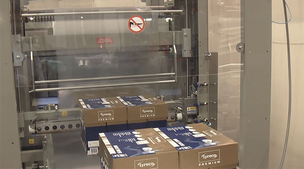 Video of automatic sleeve wrapper wrapping A4 boxes