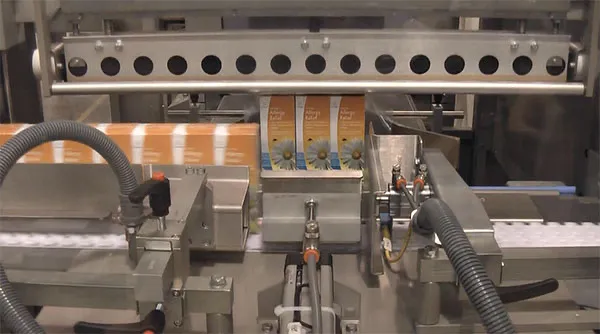 Video of automatic sleeve wrapper packaging individual medicine cartons