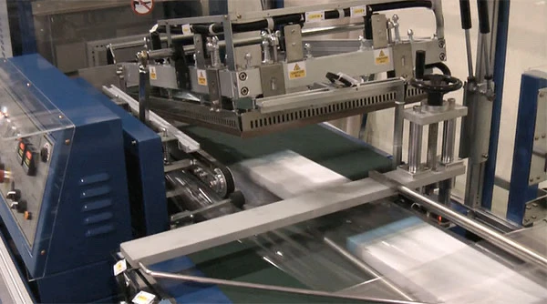 automatic l sealer wrapping pharmaceutical cartons video